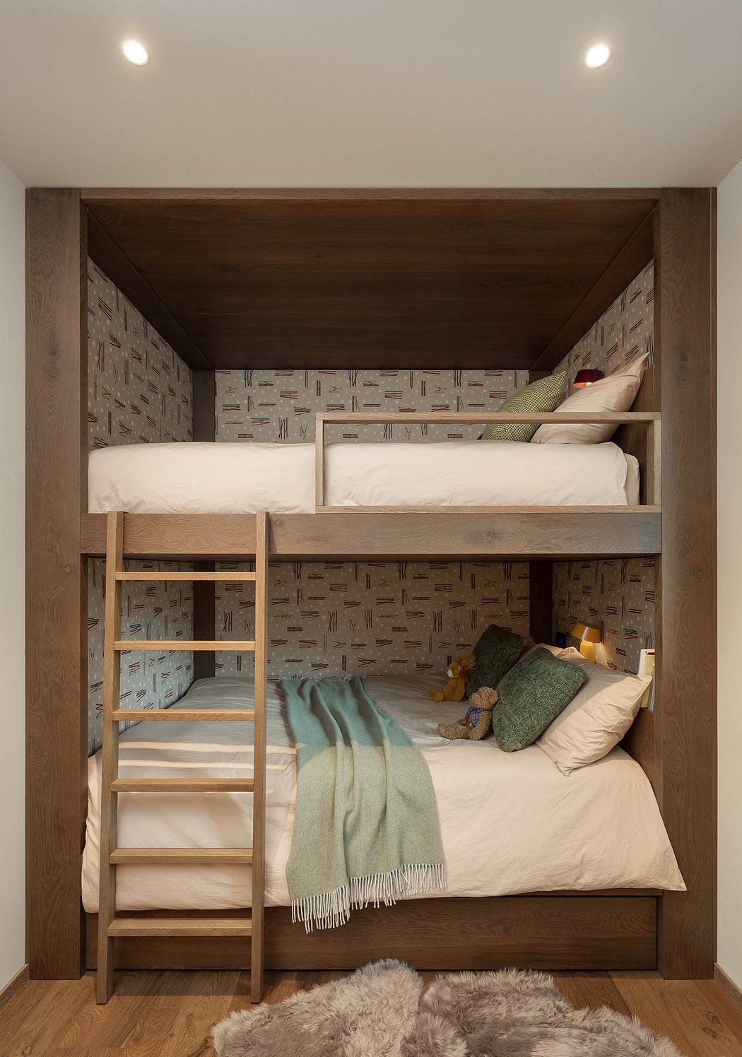 Cozy wooden bunk beds built into a nook with warm lighting.