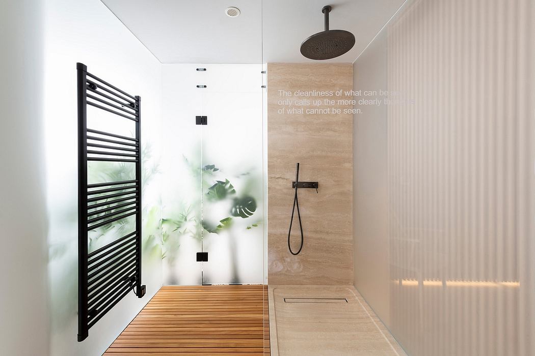 A modern bathroom with a black metal towel warmer, wooden-look walls, and a glass shower.