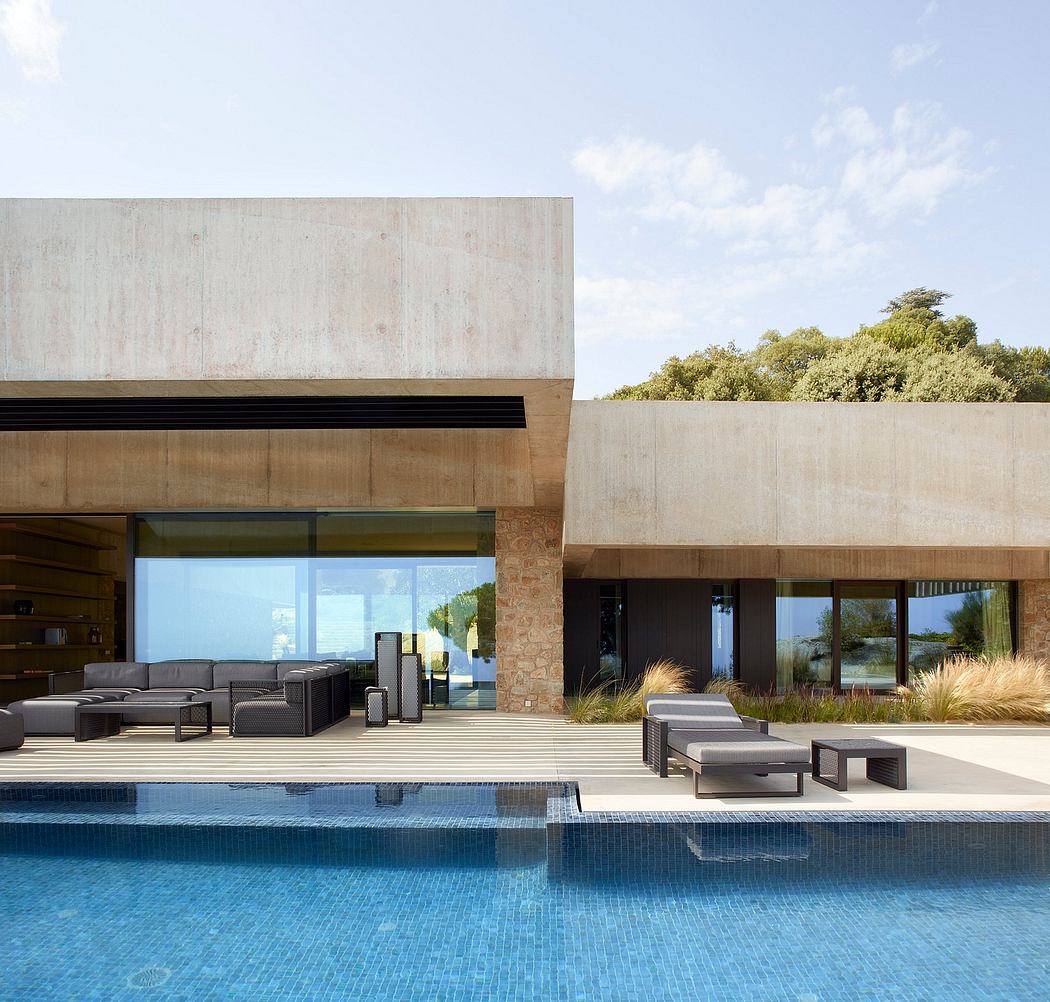 Contemporary house with poolside outdoor seating.