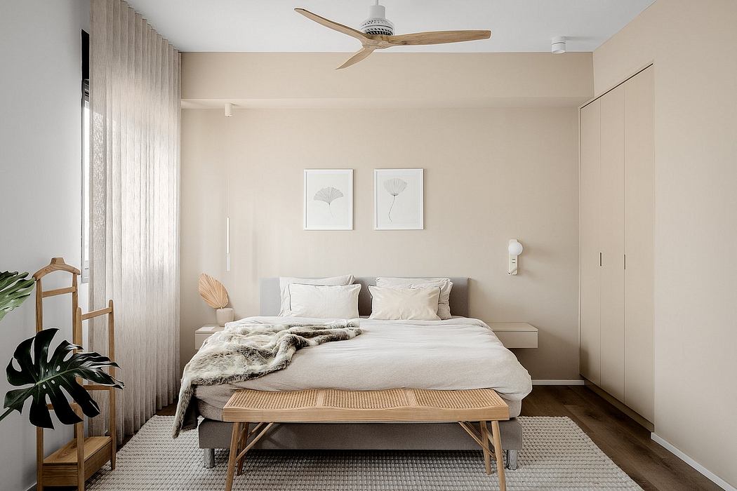 Minimalist bedroom with neutral tones and clean lines.