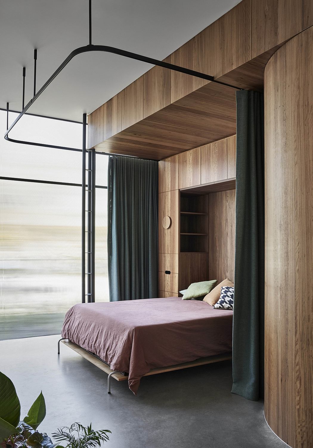 Minimalist bedroom with wooden walls, modern lighting, and a suspended bed.