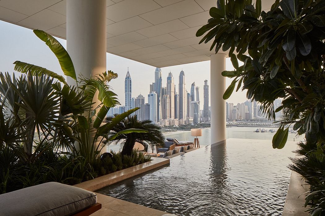 Lush indoor pool oasis with sweeping views of Dubai's modern skyline.