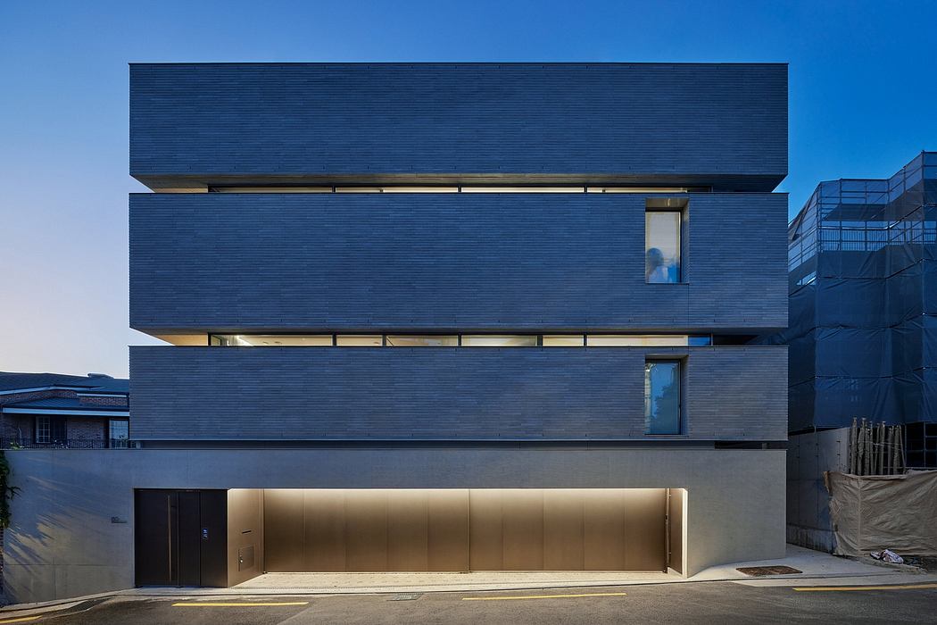 Contemporary multi-tiered building with clean lines and large windows.