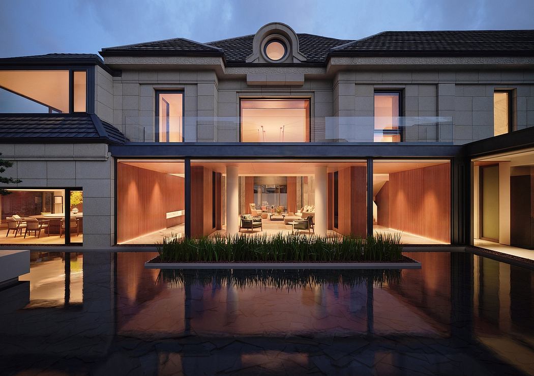 Elegant modern home with expansive glass facades, reflecting pool, and lush greenery.