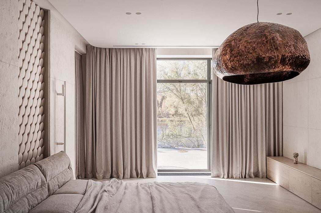 Spacious bedroom with large window, plush curtains, and distinctive dome-shaped light fixture.