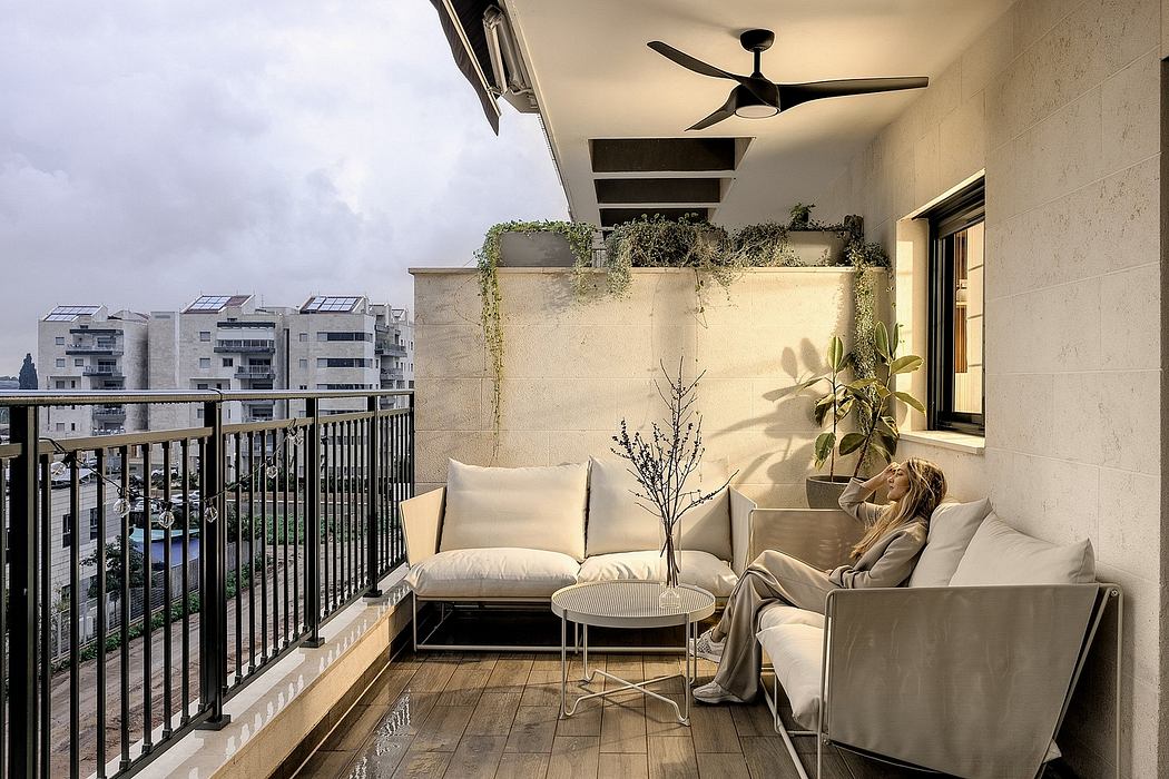 Contemporary balcony with neutral tone decor and city view.