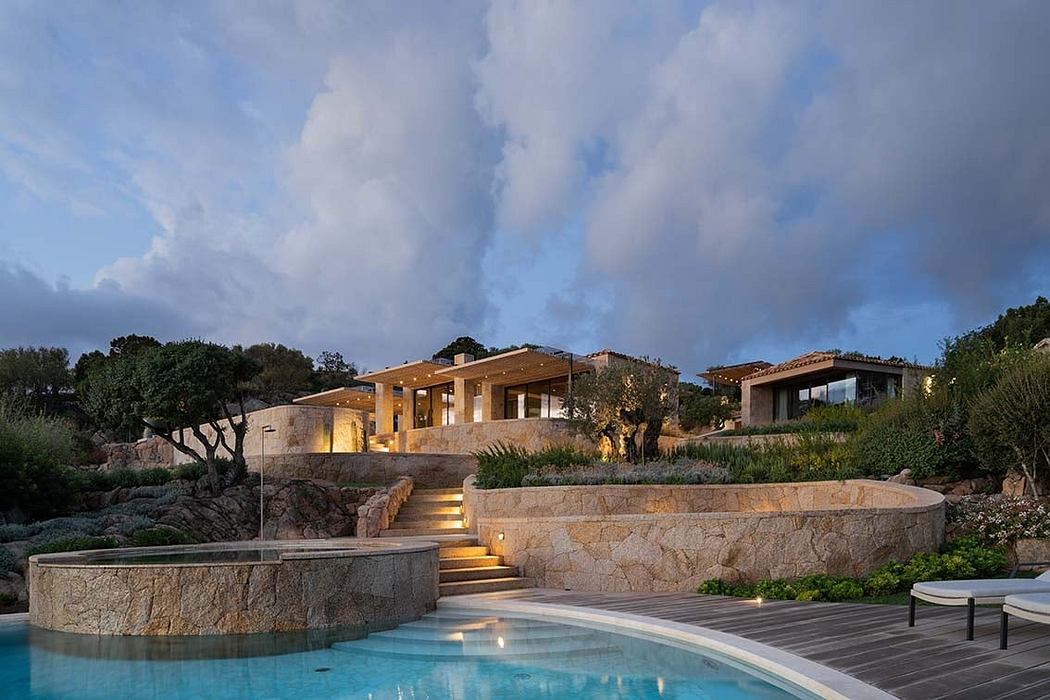 Luxury house with pool at dusk, modern design with natural surroundings.