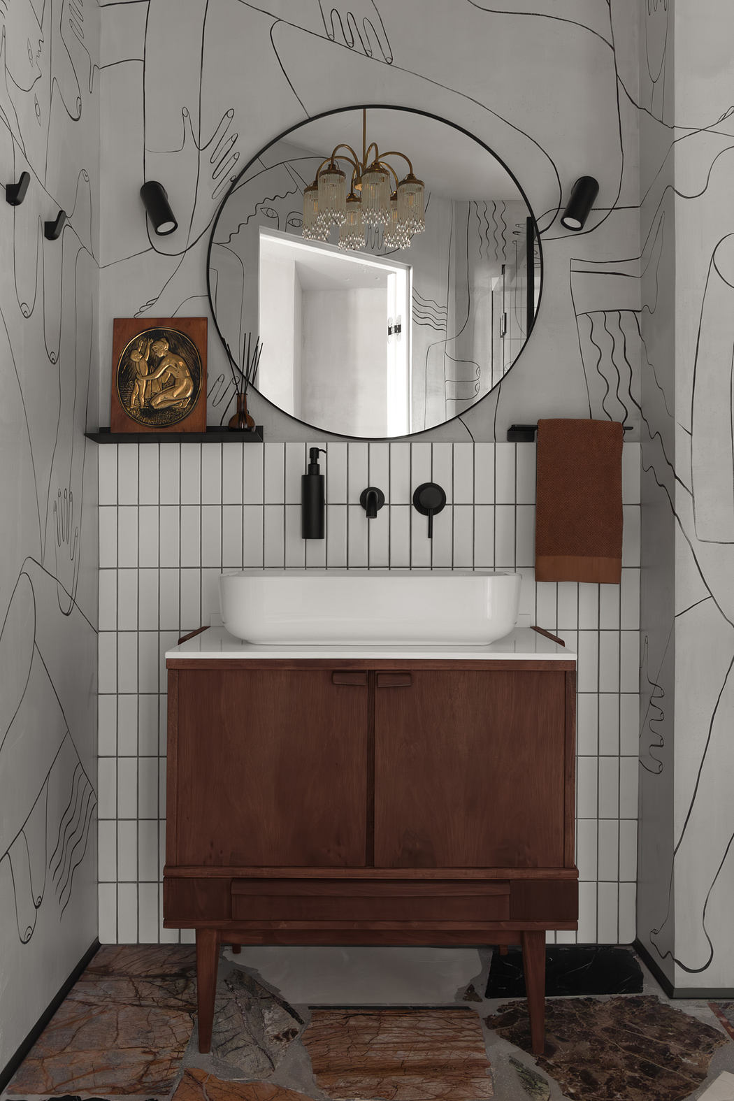 A visually striking bathroom with a round mirror, a dark wood vanity, and a patterned tile wall.