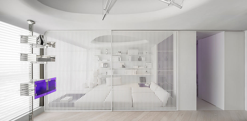 Modern minimalist interior with geometric wall art, shelving, and purple accents.