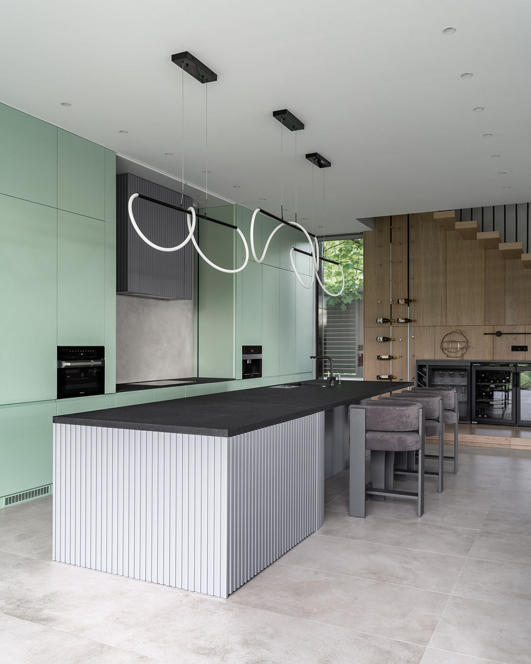 A modern kitchen with sleek cabinetry, minimalist lighting, and a statement island.