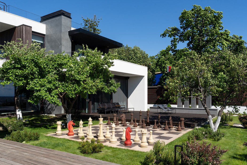 Architectural elements blend seamlessly with lush landscaping, creating an inviting outdoor space.