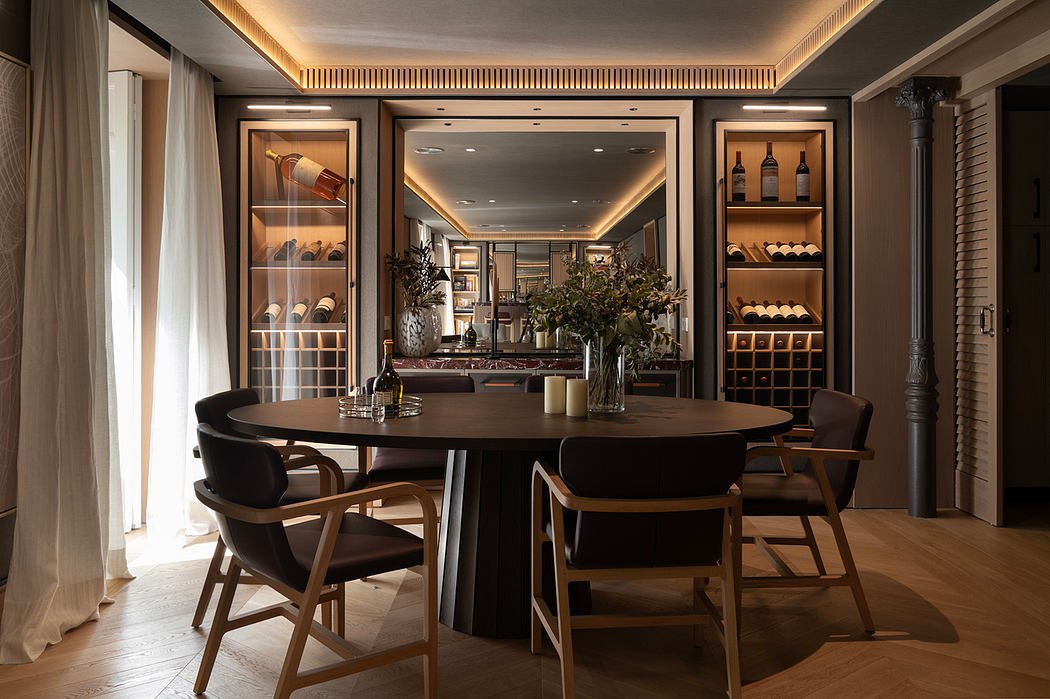 Elegant dining area with wooden furnishings, built-in wine storage, and decorative lighting.