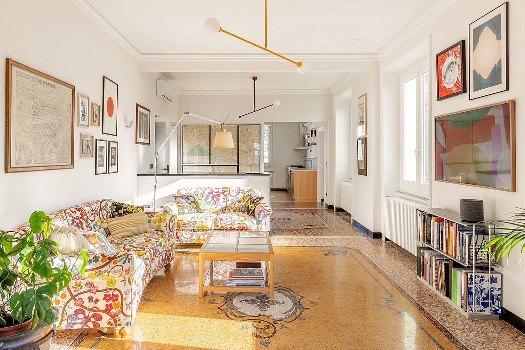 Spacious and eclectic living room featuring ornate tile flooring, vibrant artwork, and custom lighting.