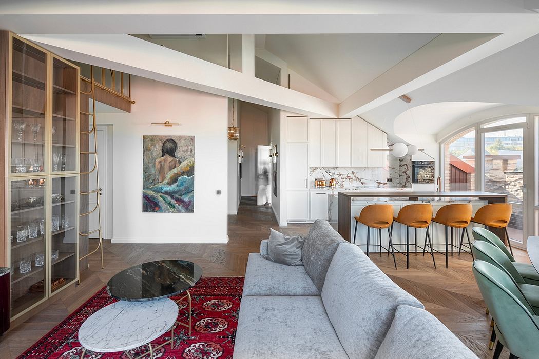 Spacious open-concept kitchen and living area with modern furnishings, wood floors, and arched windows.