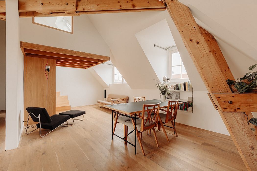 Bright, spacious loft with wooden beams, minimalist furnishings, and natural materials.