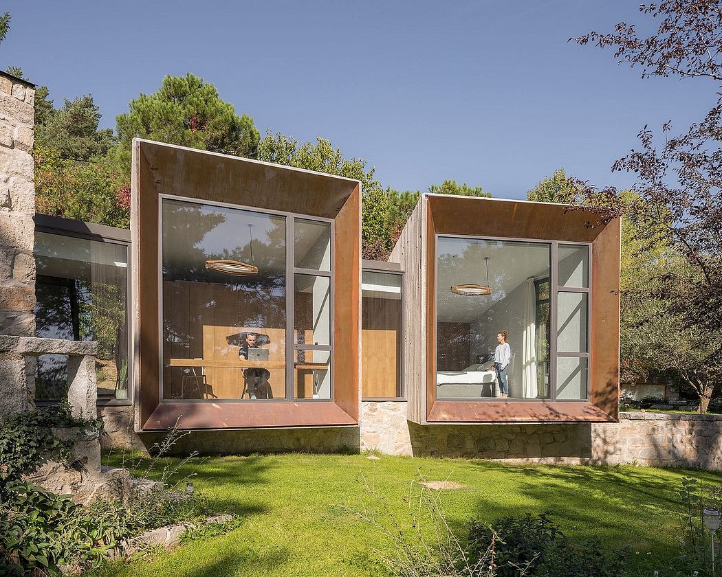 Modern modular design with glass walls, wooden frames, and stone accents surrounded by lush greenery.