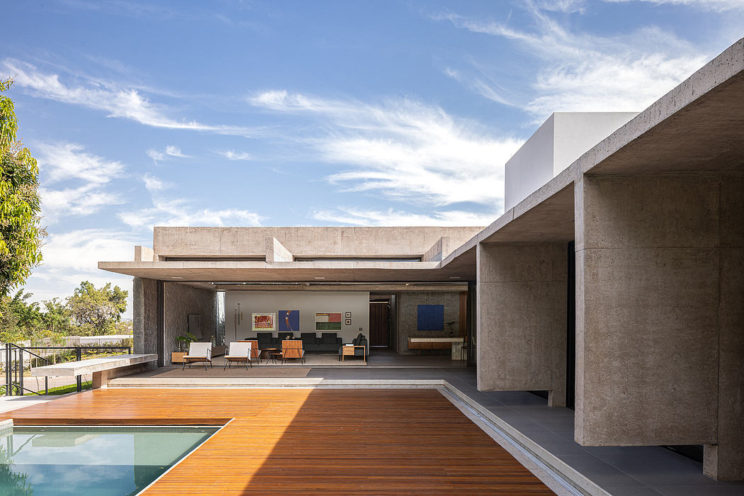 Striking architectural design featuring concrete structures, open-air layout, and pool.
