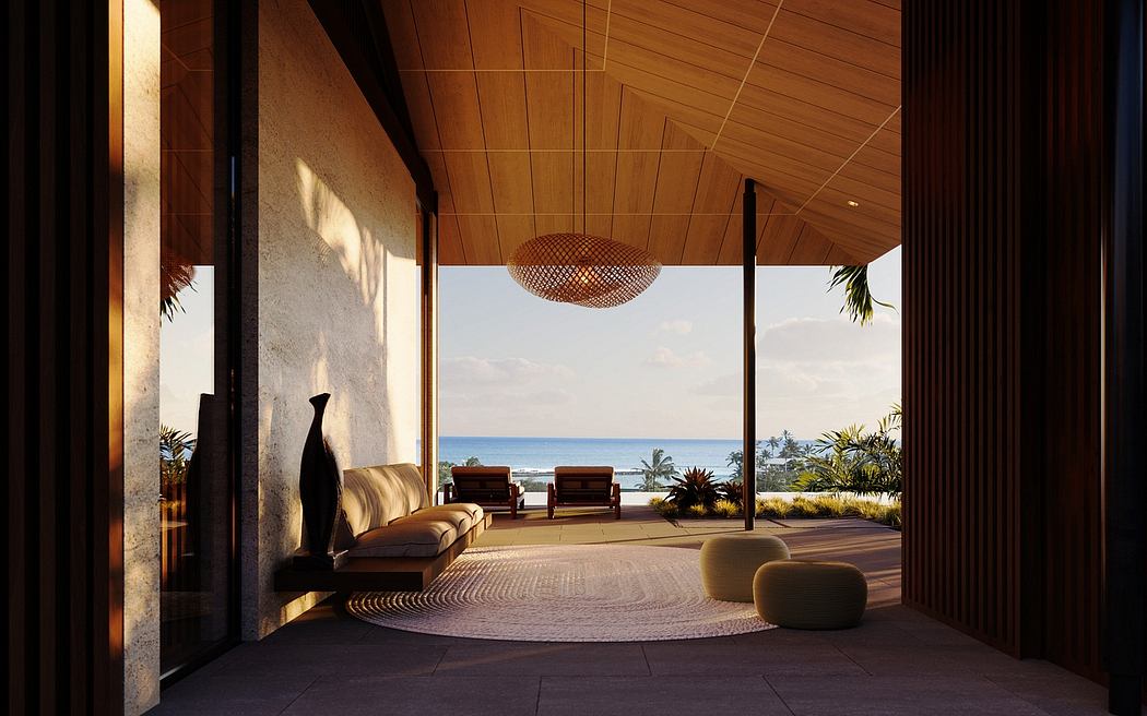 Luxurious, beachfront living space with a wooden-paneled ceiling, hanging light fixture, and panoramic ocean view.