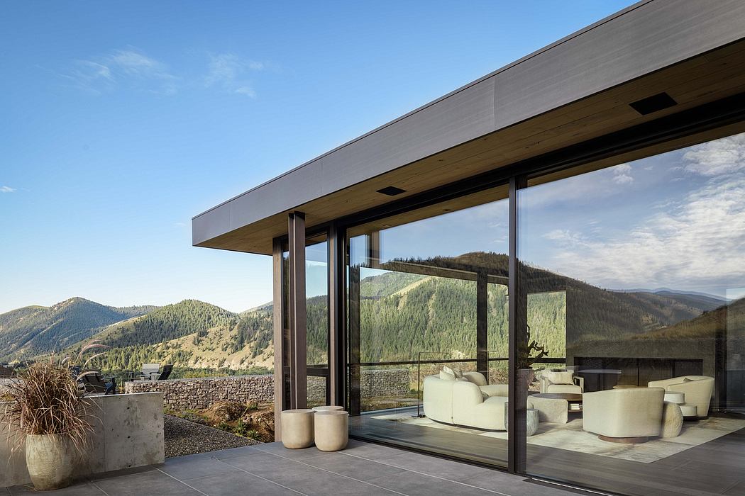 A modern mountain retreat with sleek architecture, open floor plan, and panoramic views.