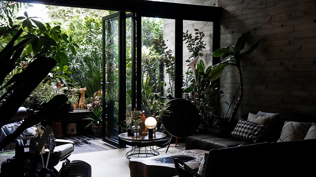 A cozy indoor oasis with lush foliage, modern furniture, and sleek architectural elements.