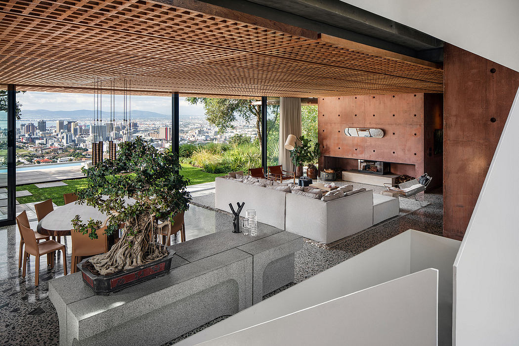 Expansive, modern living room with wood-beamed ceiling, concrete accents, and panoramic city view.