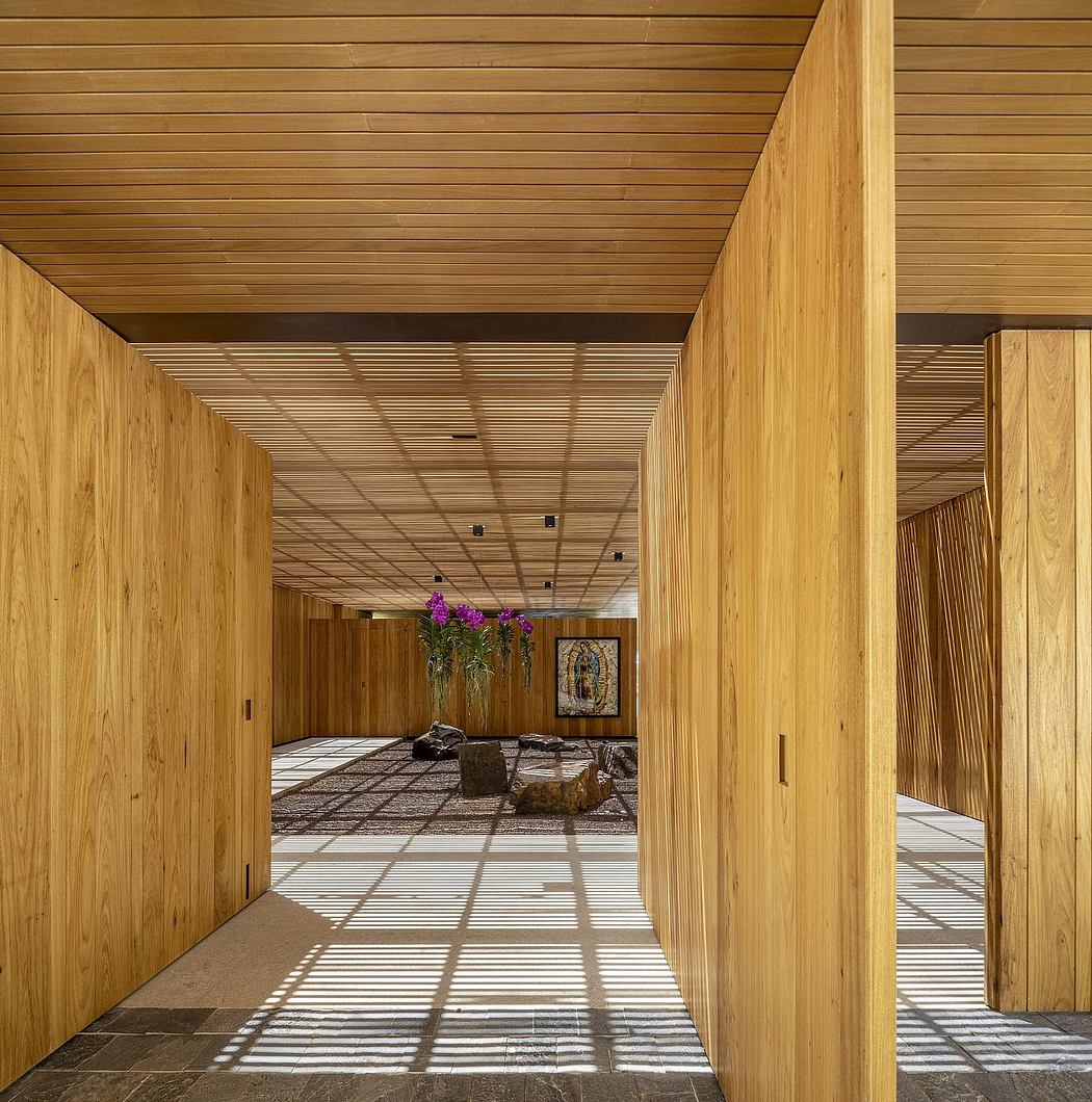 A striking wood-paneled hallway with geometric patterns and natural lighting.