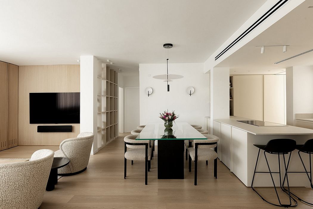 Modern open-concept living and dining area with sleek furnishings and lighting.