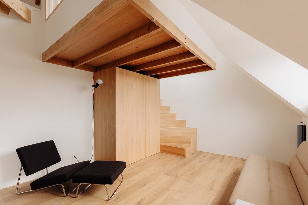 Warm-toned wooden beams, stairs, and furniture showcase minimalist, modern design.