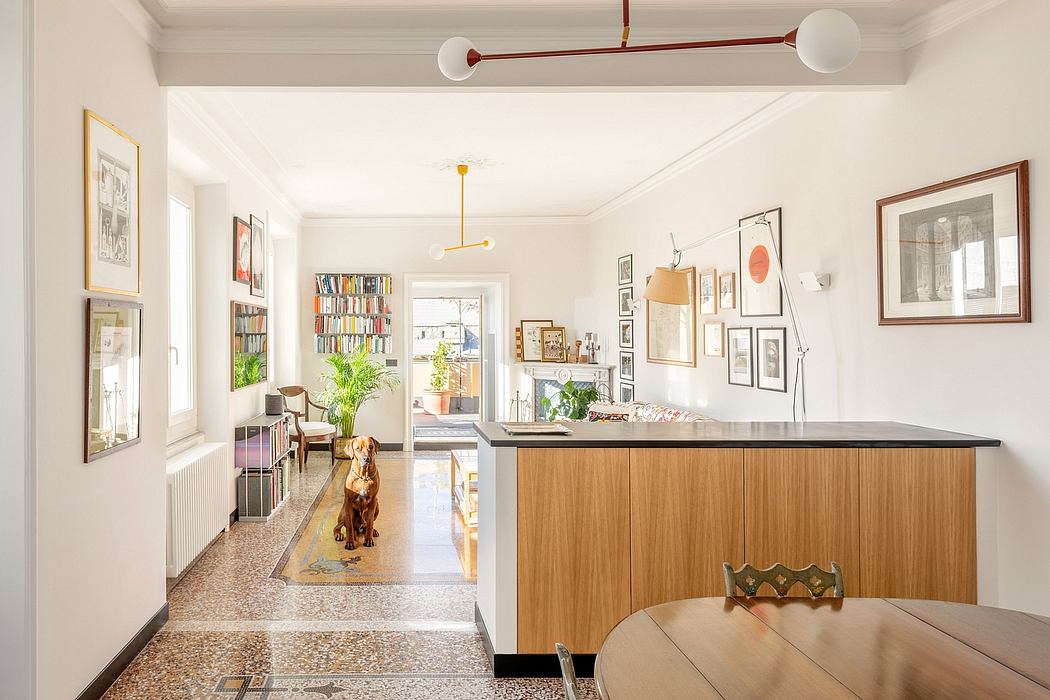 Bright, airy living space with mid-century modern furnishings and extensive artwork display.