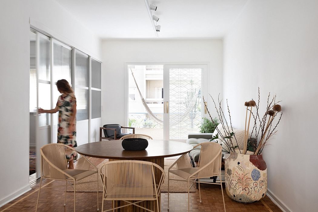 Bright, minimalist interior with wooden furniture, decorative plants, and textured accents.