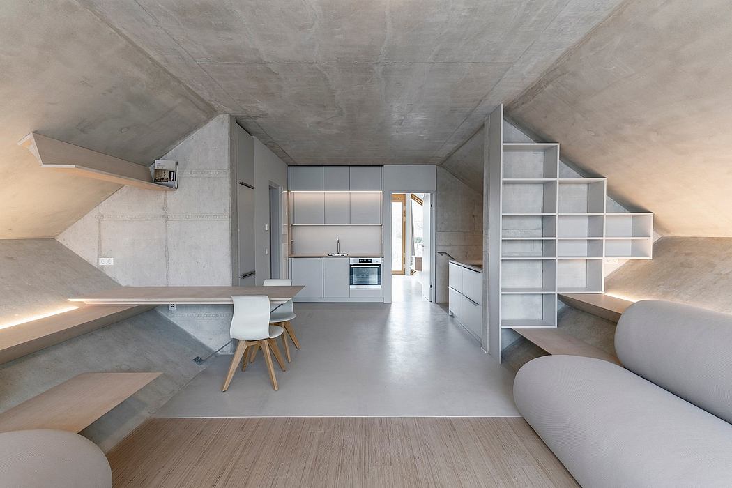 Minimalist concrete interior with sleek built-in furniture and storage units.