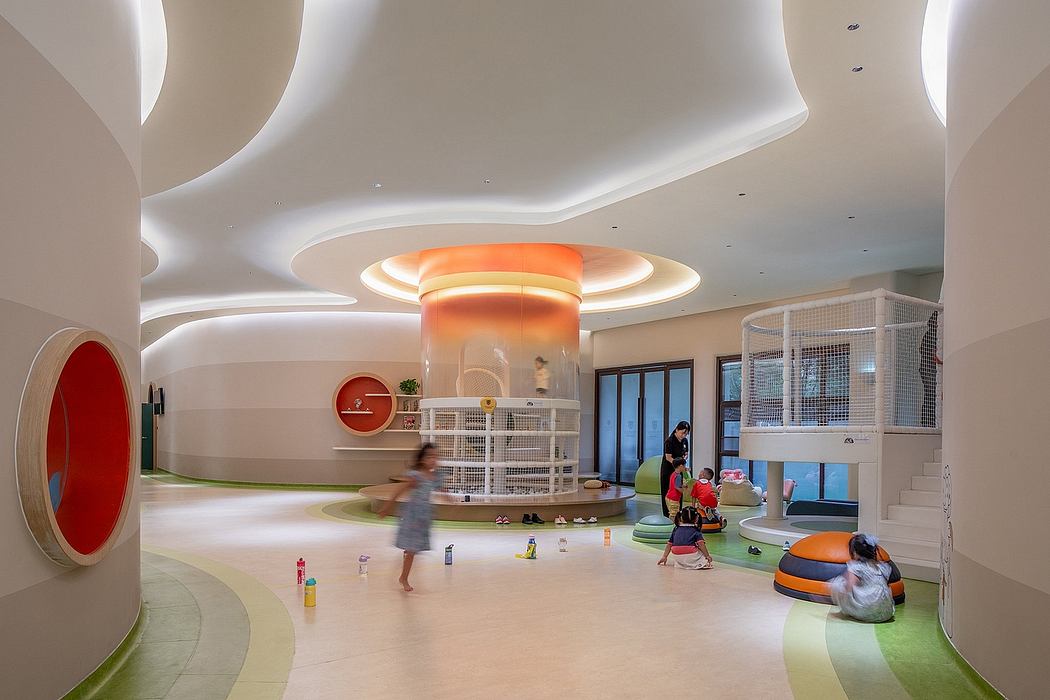 Vibrant, playful interior space with curved walls, lighting, and colorful seating.