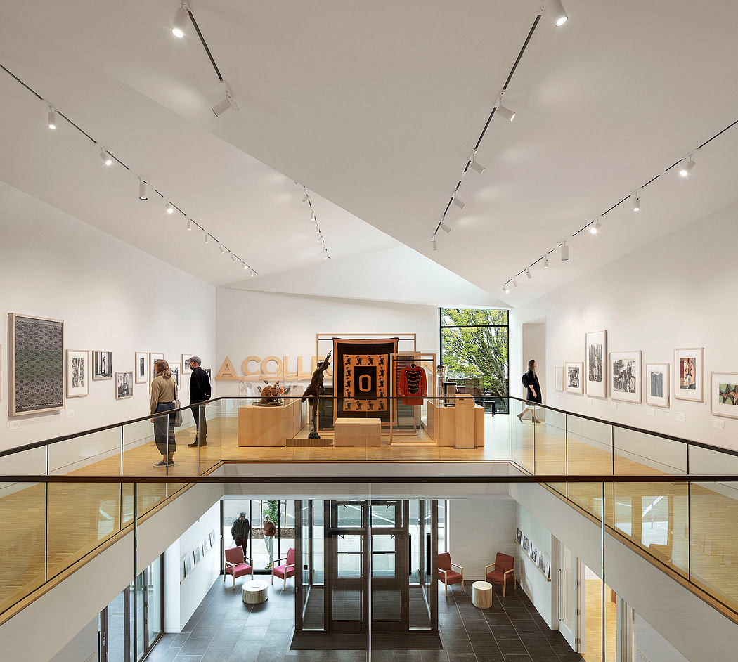 Spacious art gallery with sleek modern architecture, high ceilings, and track lighting.