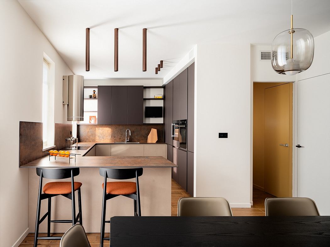 Sleek contemporary kitchen with dark wood accents, recessed lighting, and a minimal aesthetic.