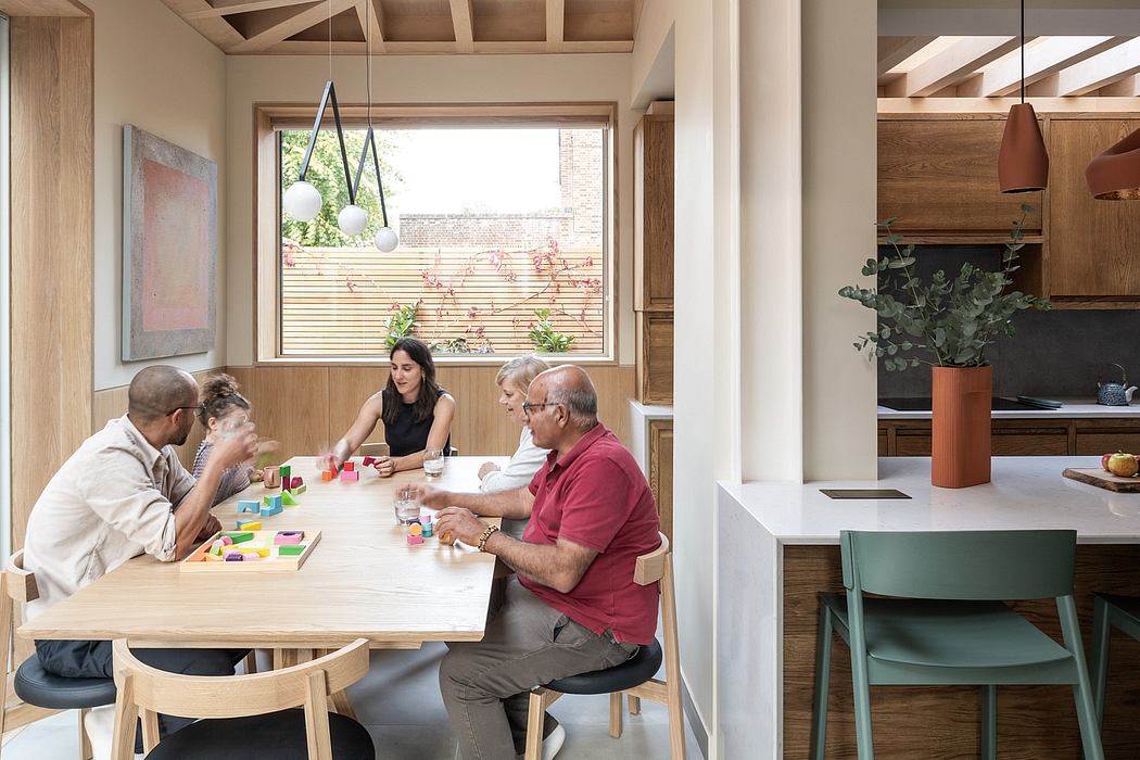 Warm, modern kitchen and dining area with wooden beams, large window, and colorful decor.