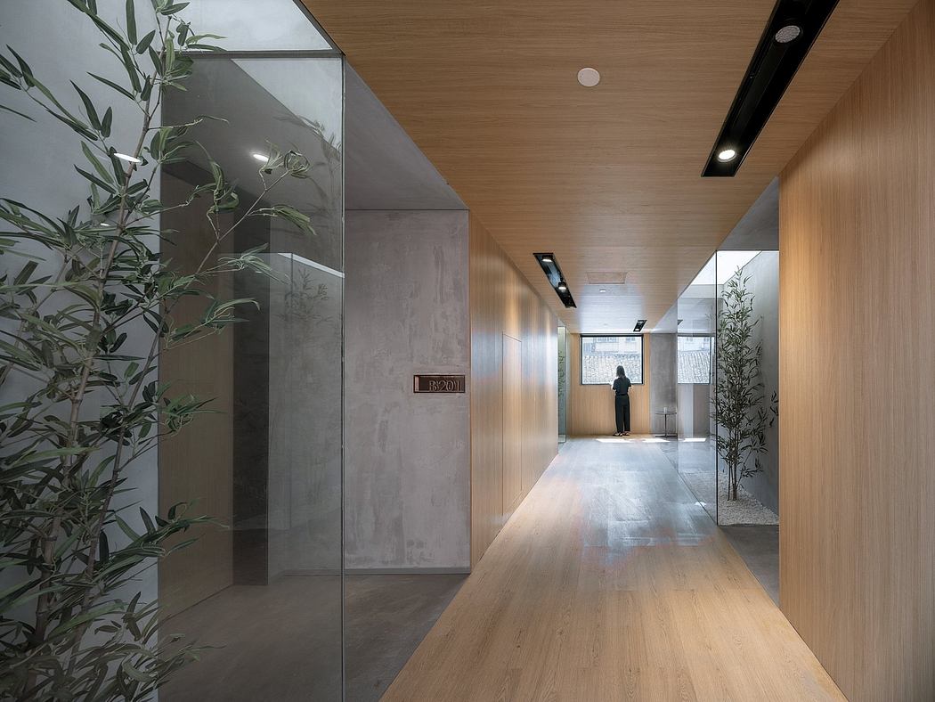 Sleek, minimalist corridor with concrete and wood elements, creating a stylish, contemporary aesthetic.