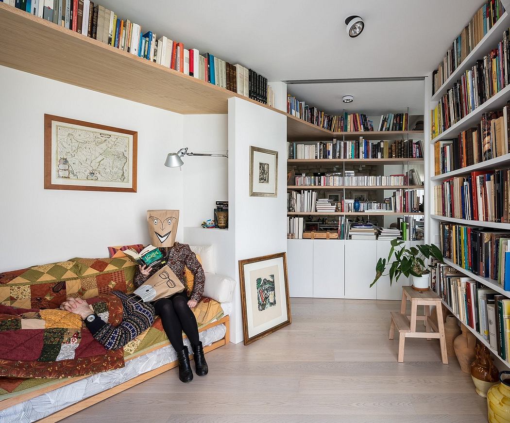 Cozy living space with built-in bookshelves, eclectic decor, and a comfortable reading nook.