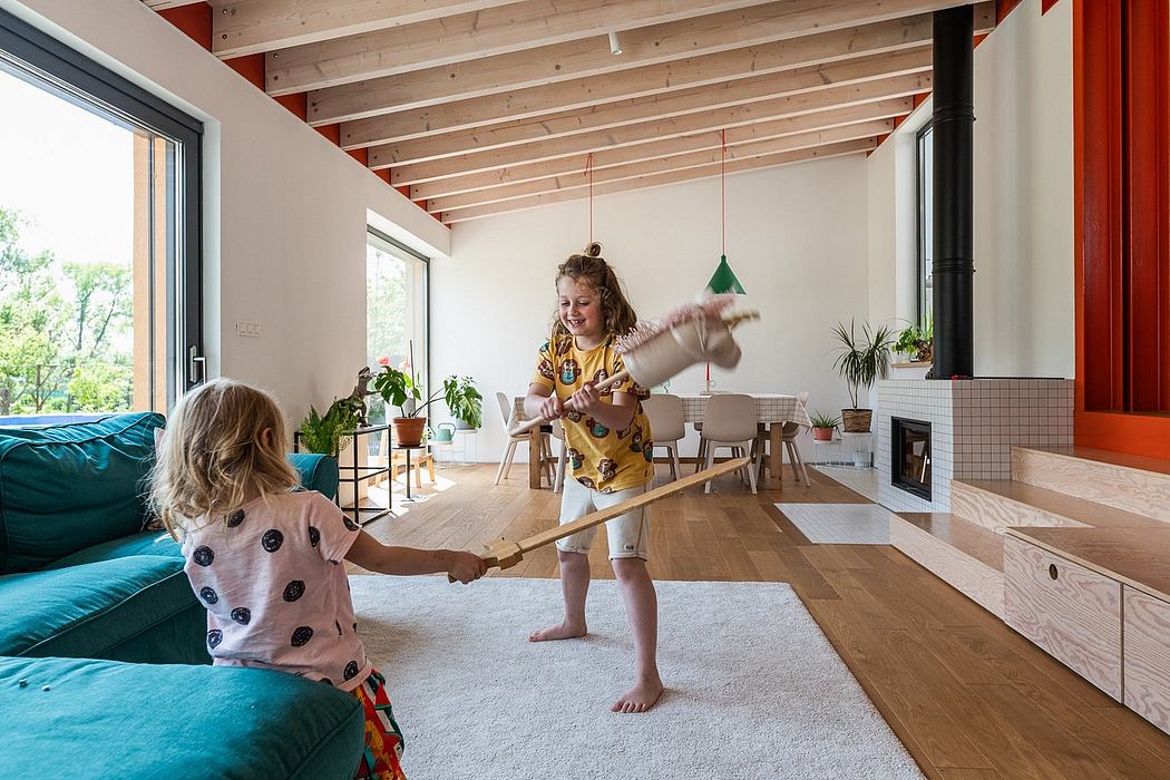 Cozy wooden beams, large windows, and pops of color create a warm, inviting space.