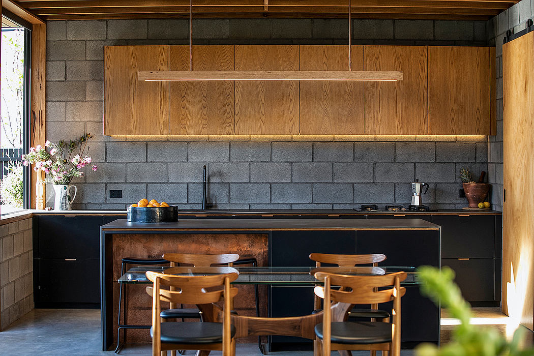 Rustic kitchen with wooden panels, concrete walls, and a modern, minimalist design.