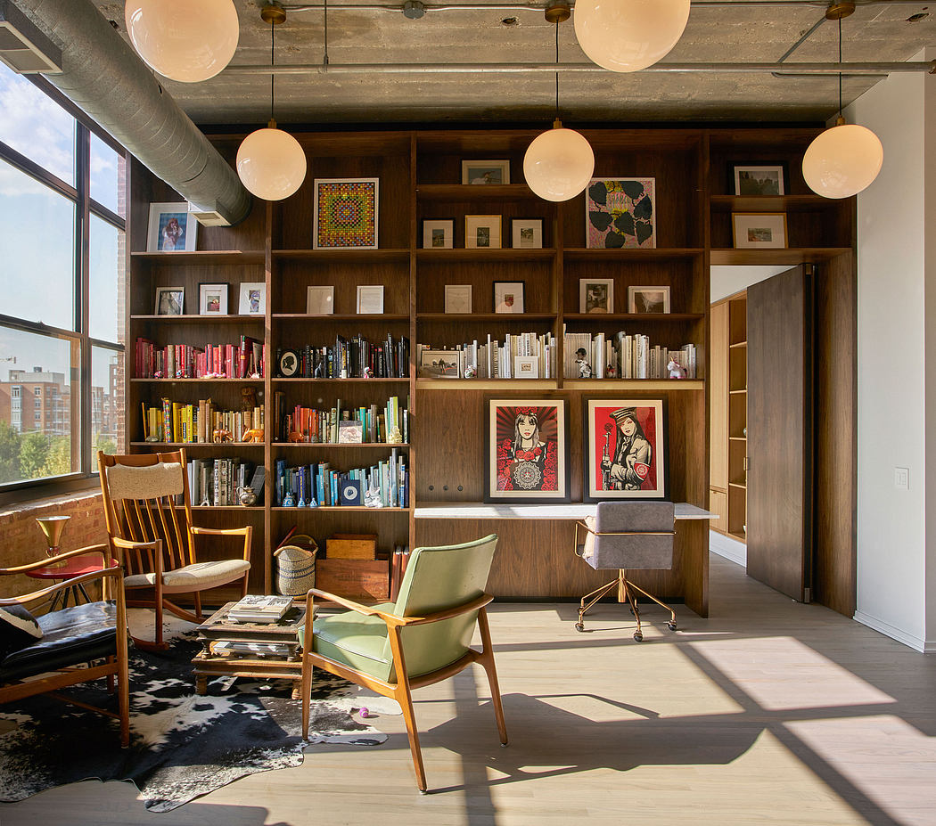 A cozy, well-lit workspace with wooden shelves, artwork, and an eclectic mix of furniture.