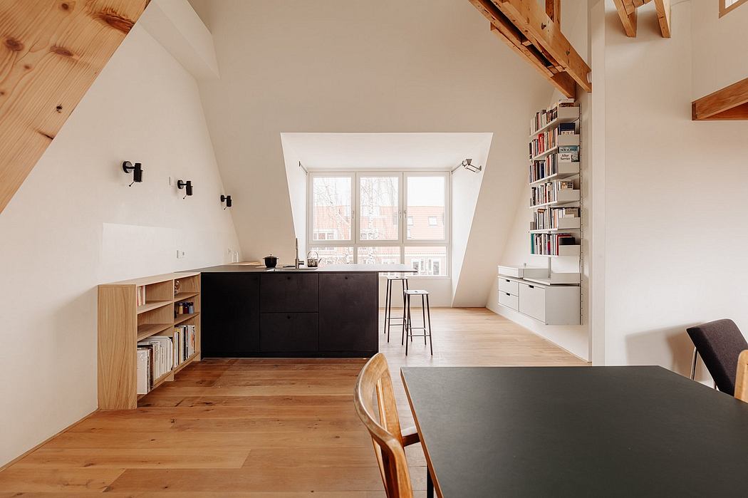 Minimalist kitchen design with wooden beams, bookshelves, and sleek black cabinetry.