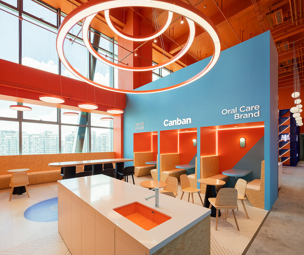 Vibrant, modern interior with circular lighting fixtures, orange accents, and an open layout.