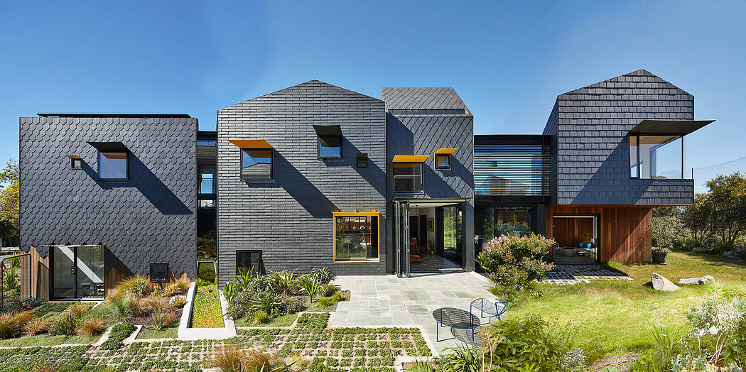Contemporary residence with geometric patterns, unique rooflines, and integrated landscaping.