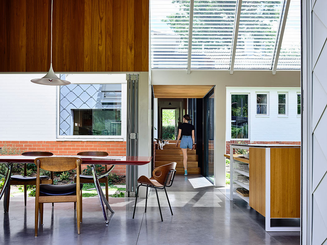 Stylish wooden furniture, patterned tiles, and sliding glass doors in modern space.