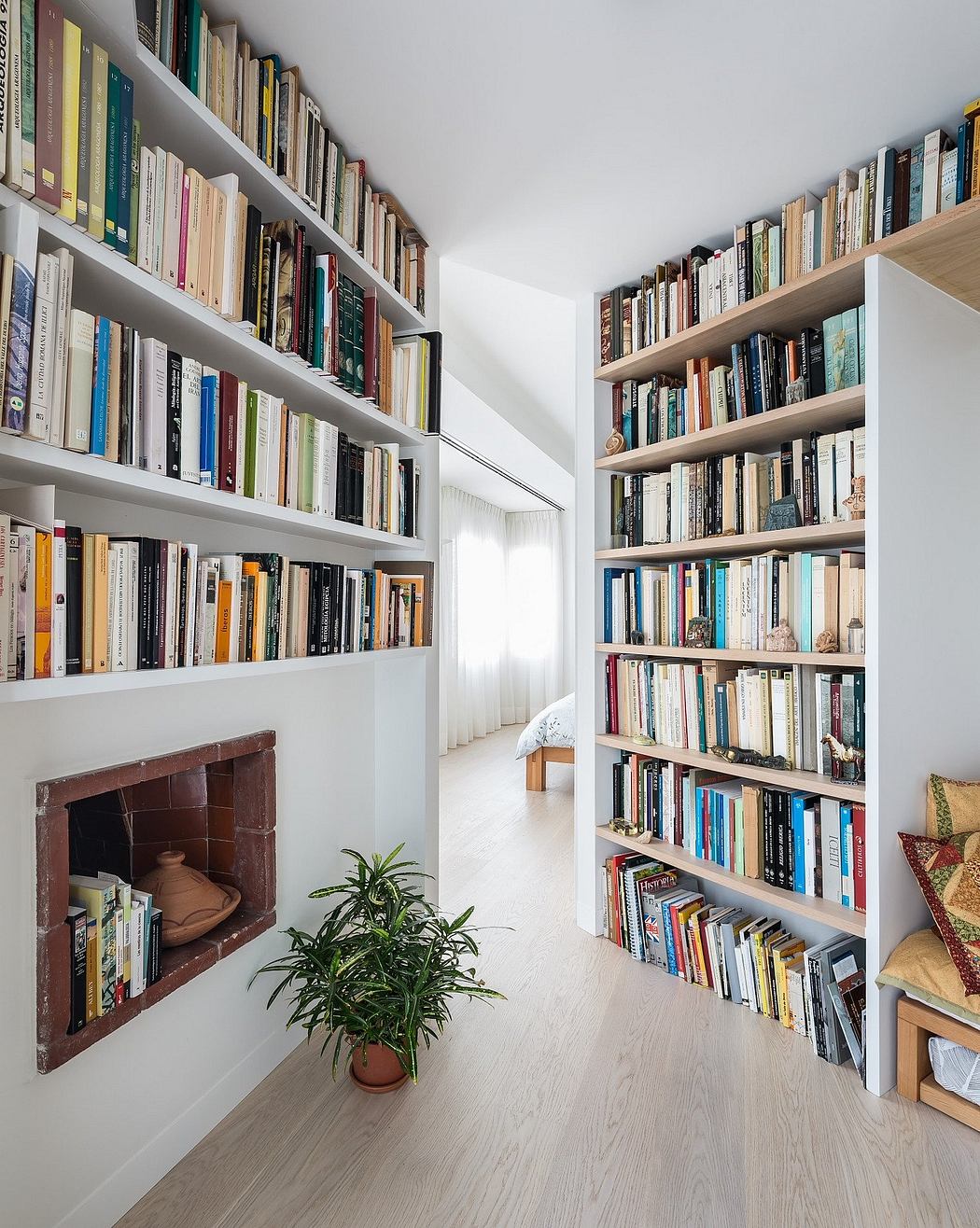 Well-organized shelving system with diverse book collection in a bright, open space.