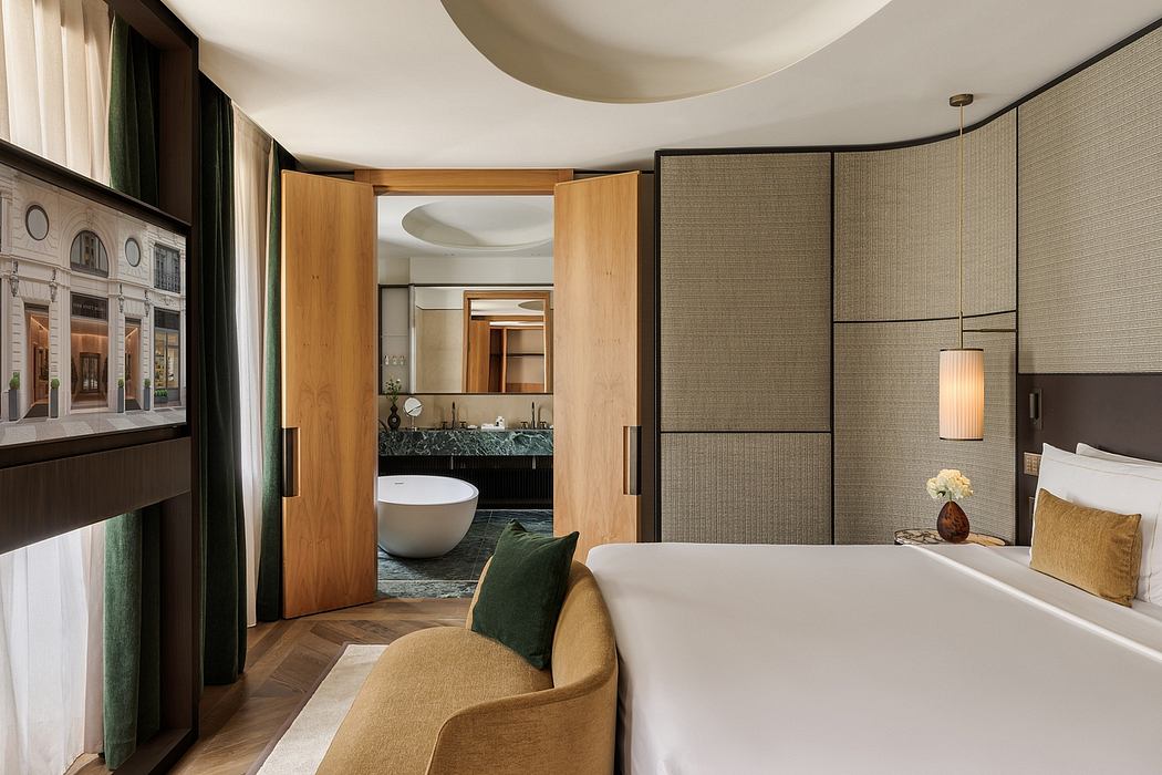 Luxurious hotel room with wooden accents, green elements, and expansive bathroom.