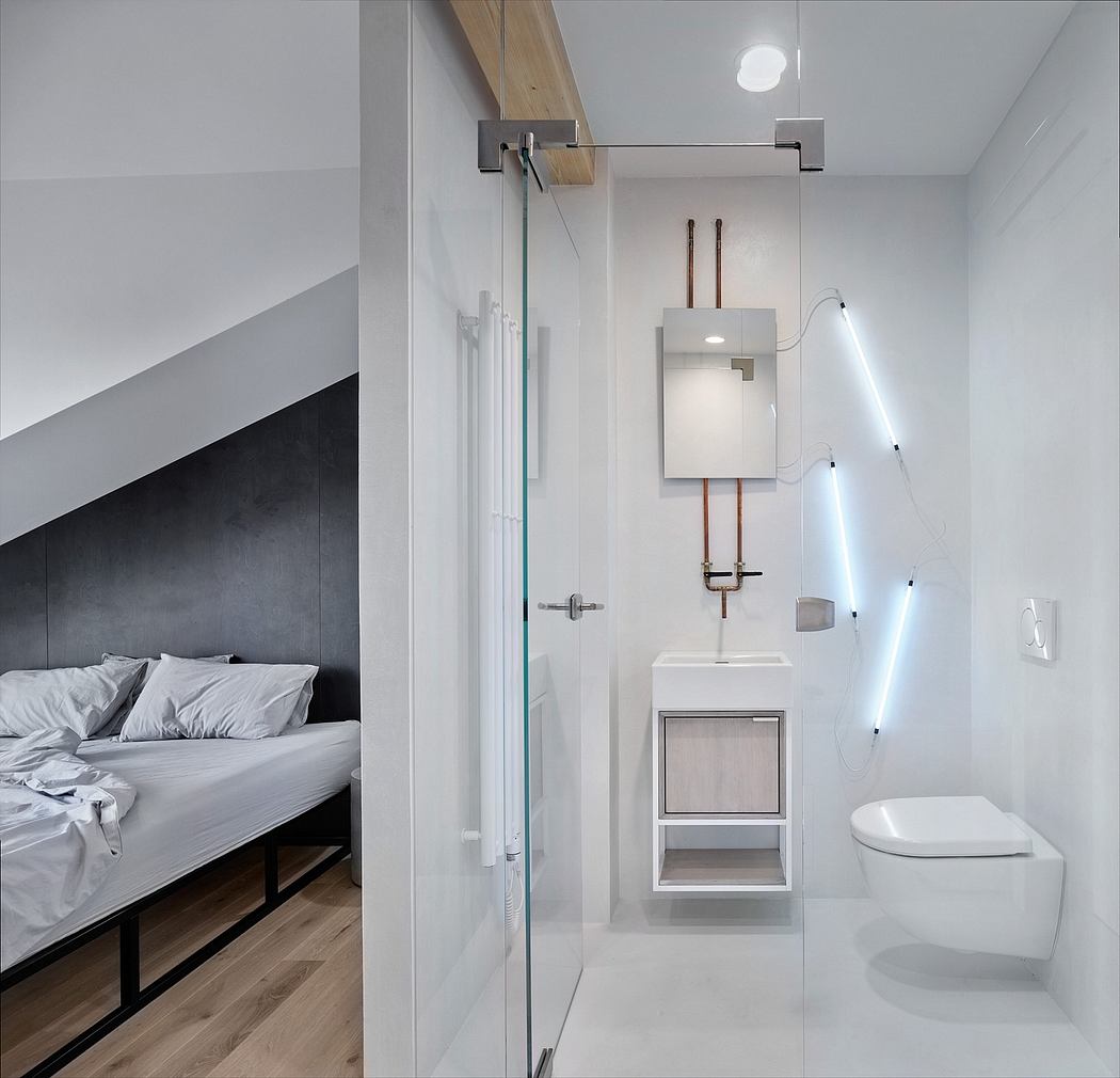 Minimalist bathroom with glass shower, wood vanity, and sleek lighting fixtures.