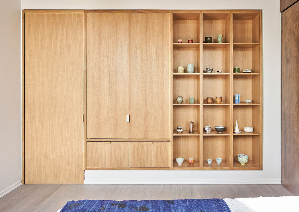 Minimalist wooden shelving system with ample storage space and display area.