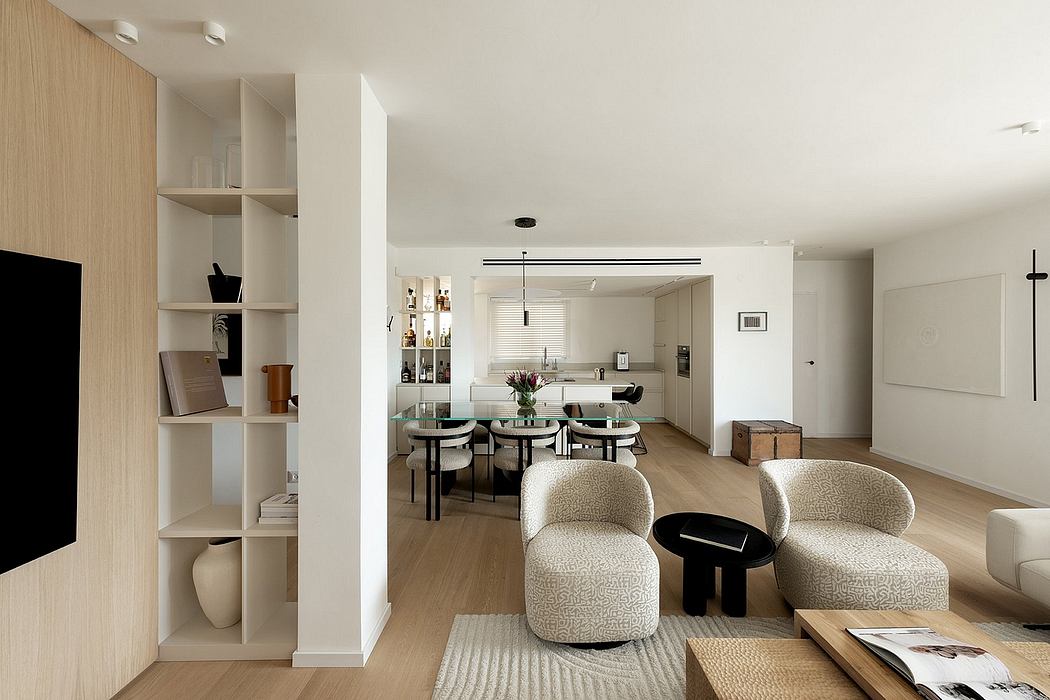 Spacious, open-concept living space with modern, minimalist furnishings and decor.