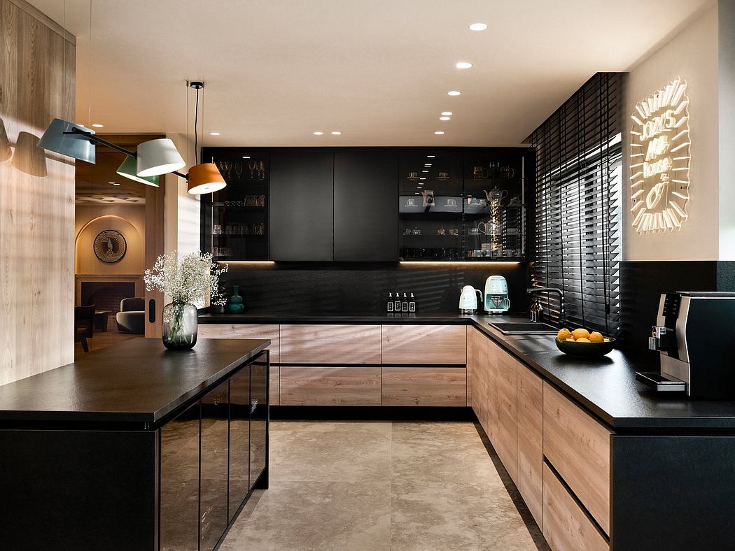 Striking modern kitchen with dark cabinetry, wood accents, and sleek lighting fixtures.